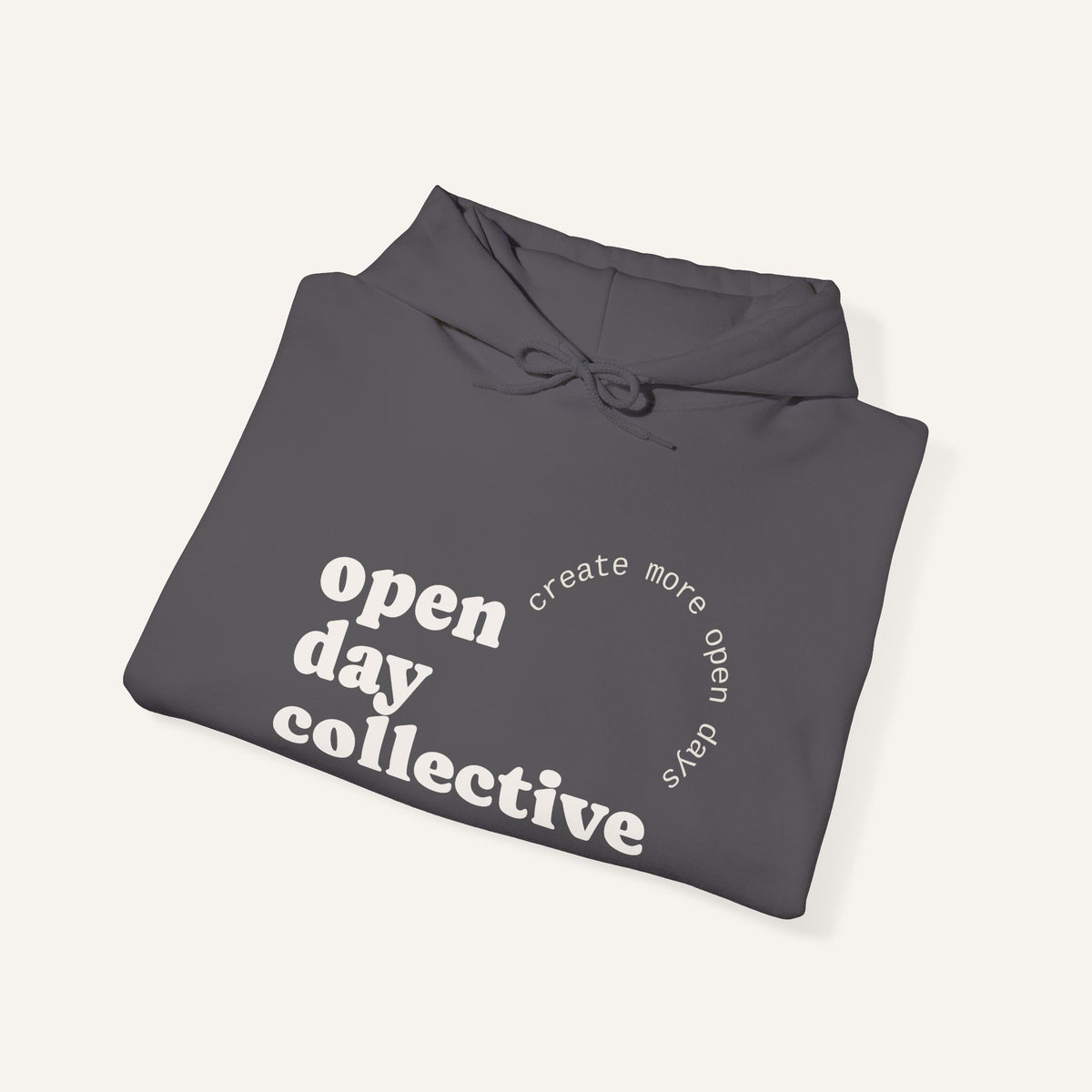 Folded grey blue hoodie with white text on a white background