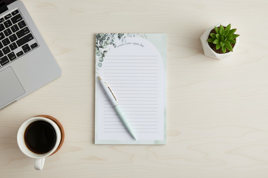 Create your open day lined notepad with pen, coffee cup, and laptop on a desk