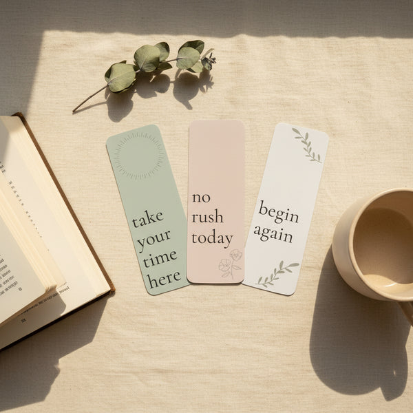Three motivational bookmarks with phrases on a light background